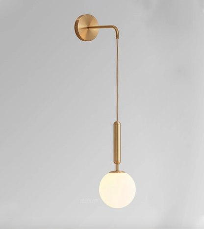 Dangling Milky Glass Globe LED Wall Light with Brushed Brass Lamp Fixture in Mid-Century Modern Style